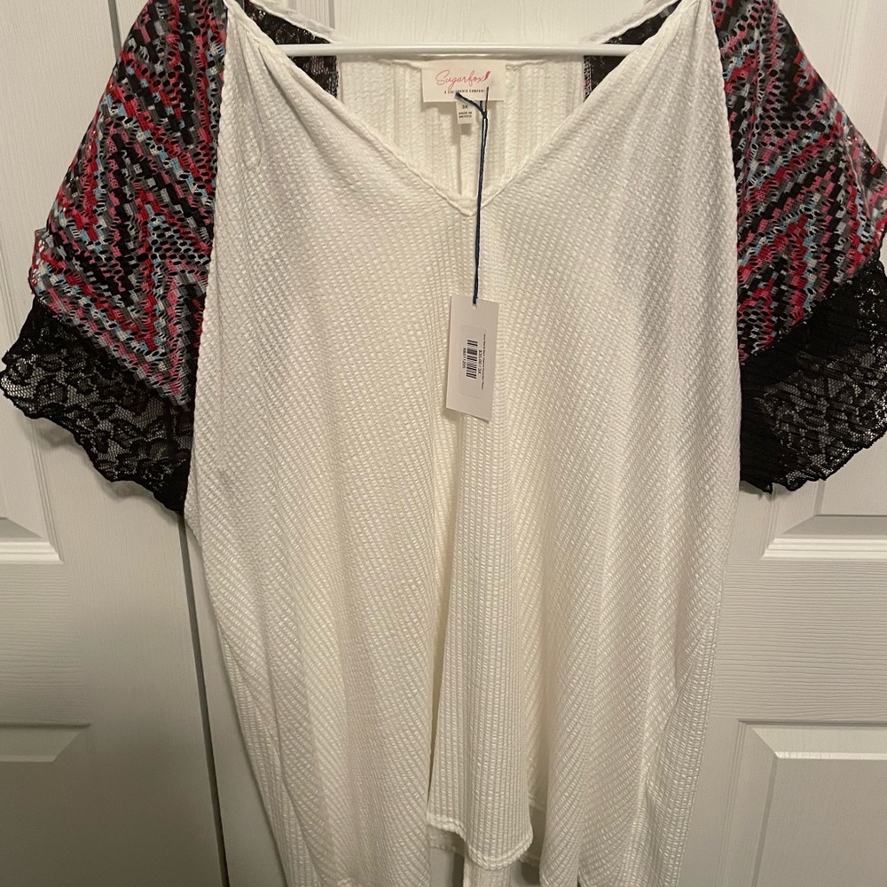 White with multi color sleeves with Black lace.